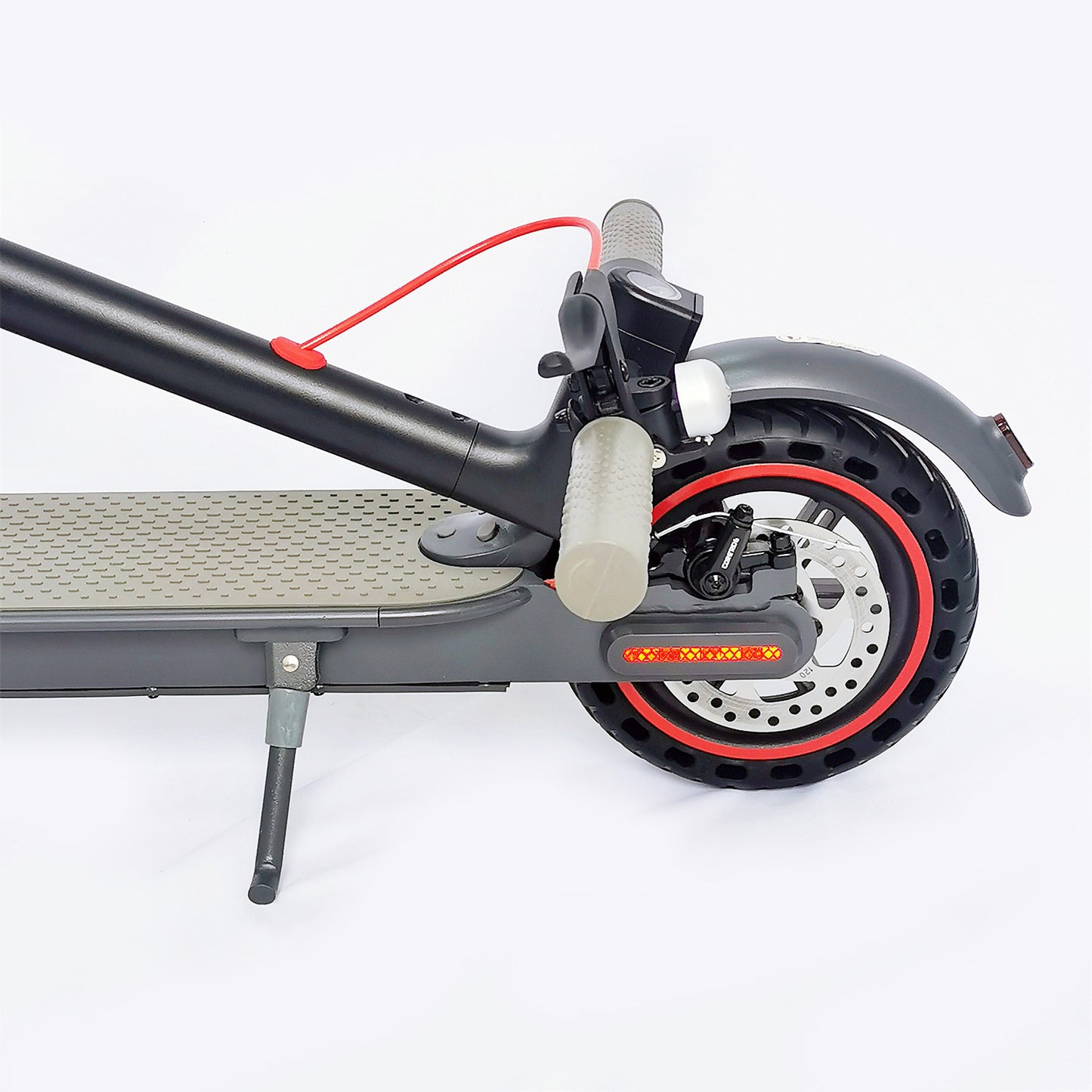 Close-up of an electric scooter's wheel and suspension on a white background